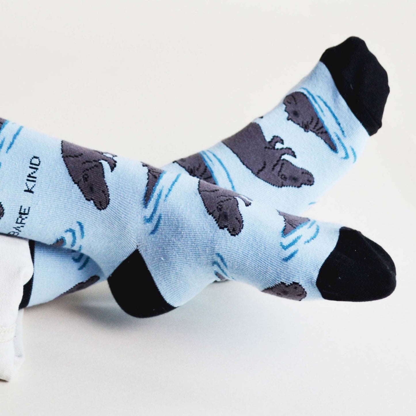 Muddy Buddies Bundle of 2 bamboo socks featuring blue pig and hippo designs for comfort and animal support