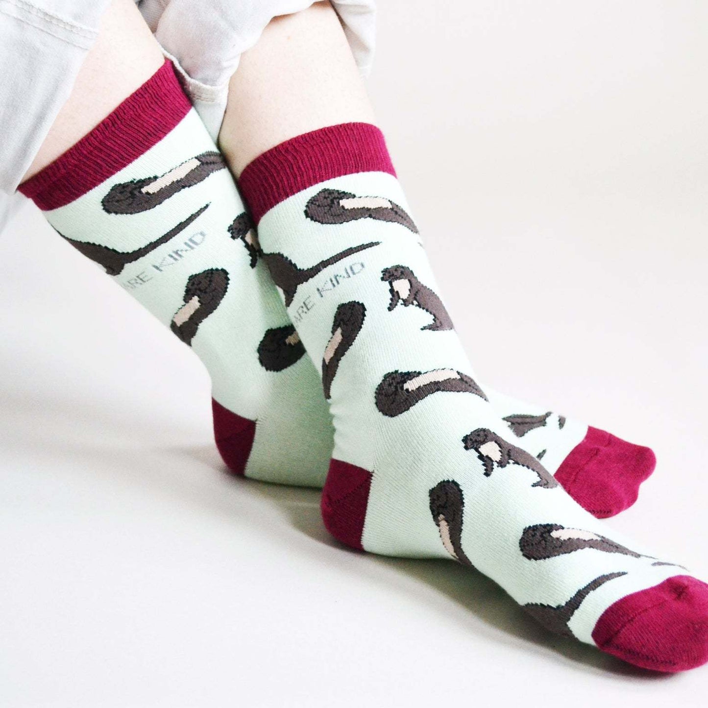 Blue bamboo socks with animated otters, supporting Save the Otters campaign