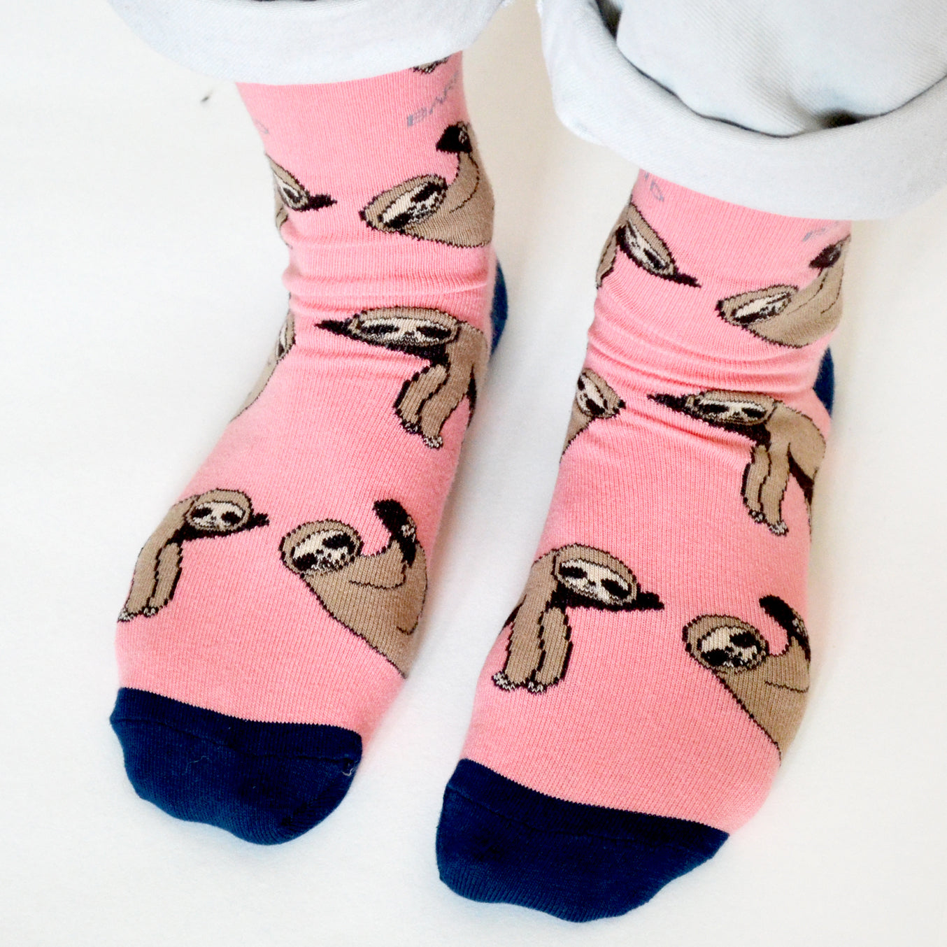 Pink Save the Sloths Bamboo Socks with animated sloth design made from breathable bamboo fiber