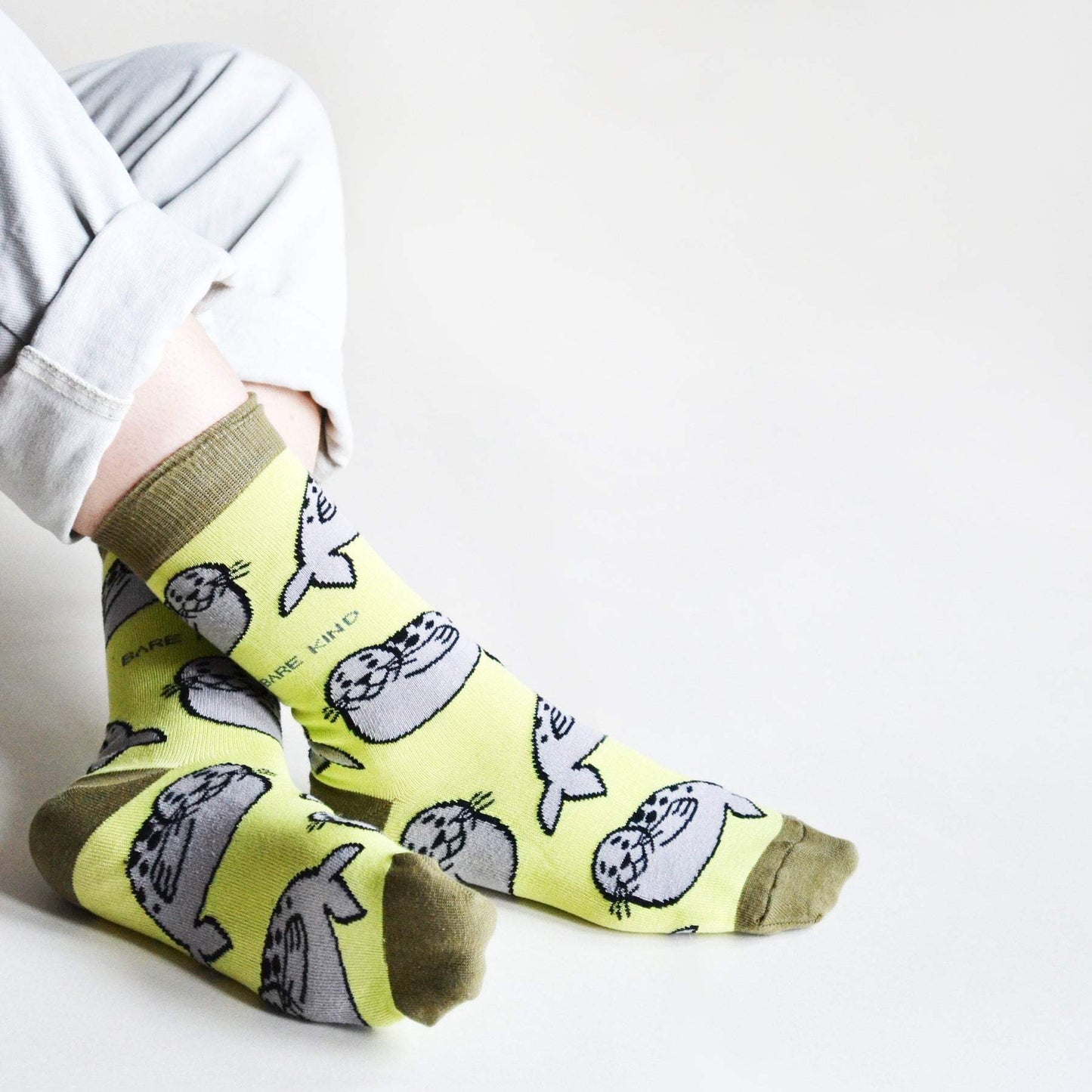 Green Save the Seals bamboo socks with animated seal designs and charity donation support
