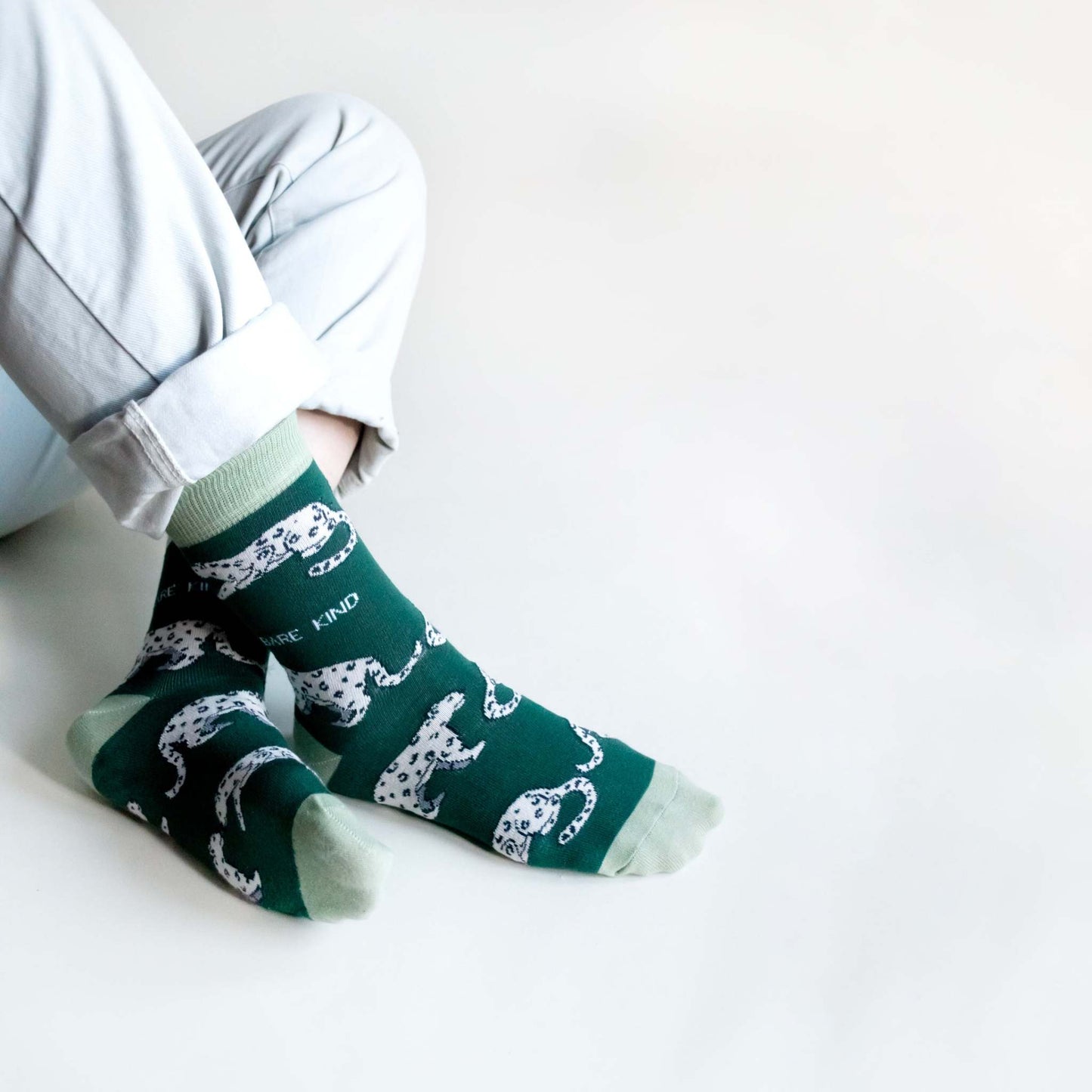 Sea green bamboo Snow Leopard Socks with animated snow leopard designs, luxurious and comfortable, supporting Snow Leopard Trust.