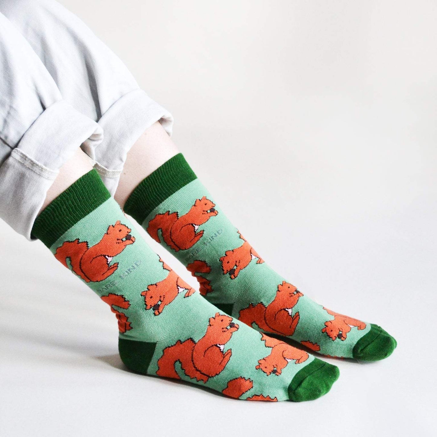 Green bamboo socks with animated red squirrels pattern promoting red squirrels conservation