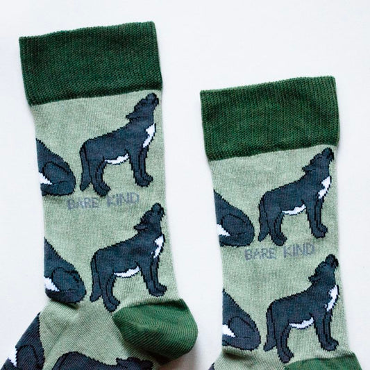 Green Save the Wolves bamboo socks with animated wolf designs, made from sustainable plush bamboo fiber