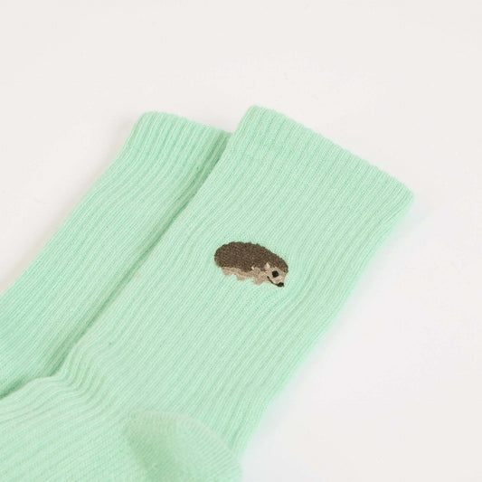 flat lays of green hedgehogs ribbed bamboo socks