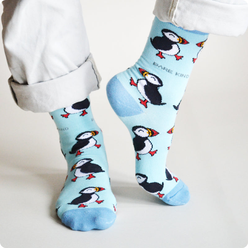 model wearing blue puffin bamboo socks