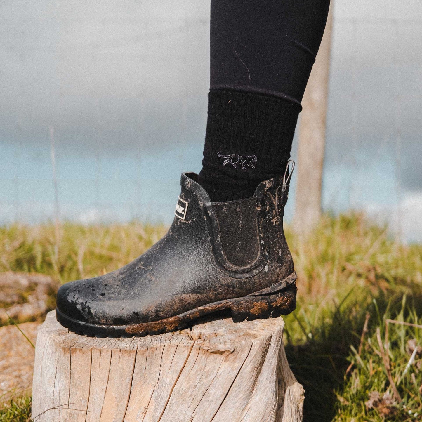 Model wearing black panther ribbed socks