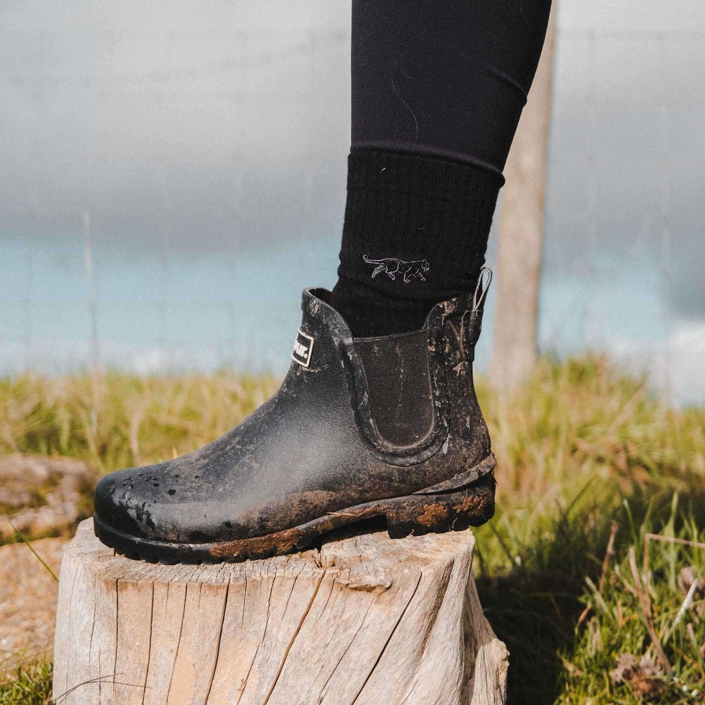 Model wearing black panther ribbed socks