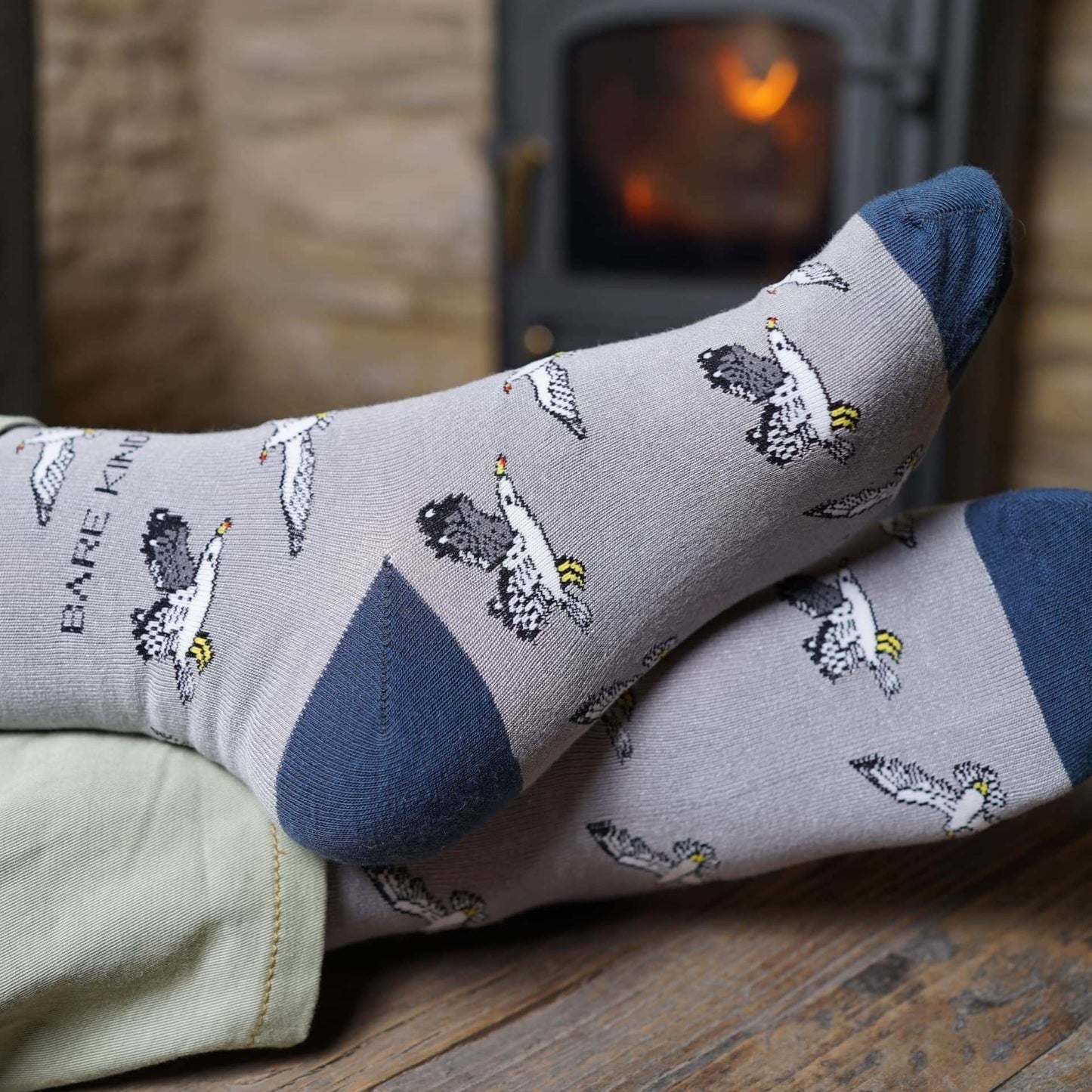 Three pairs of bamboo socks from the Flying Friends Bundle featuring Green Barn Owl, Pink Flamingo, and Grey Seagull designs