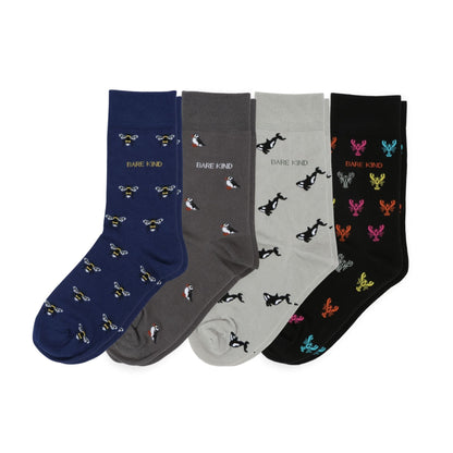Four pairs of small motif bamboo socks in blue, gray, white, and black with animal prints on a white background.