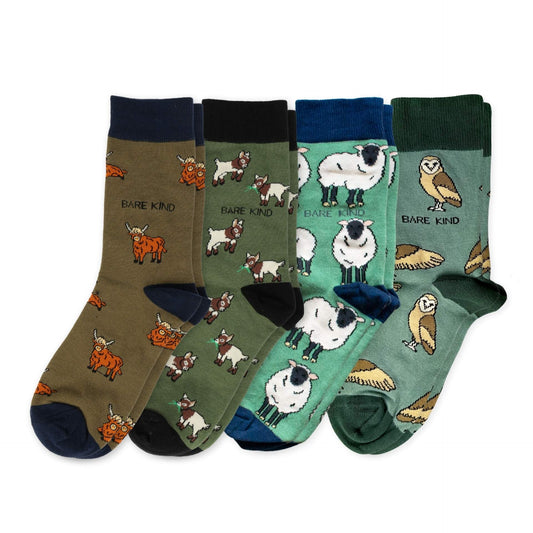 flat lays of highland cow, goat, sheep, barn owl bamboo socks