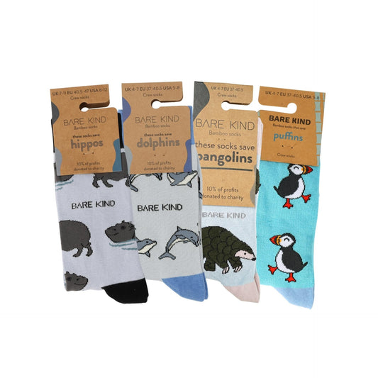 Four pairs of socks with animal illustrations and 'Bare Kind' branding on packaging.