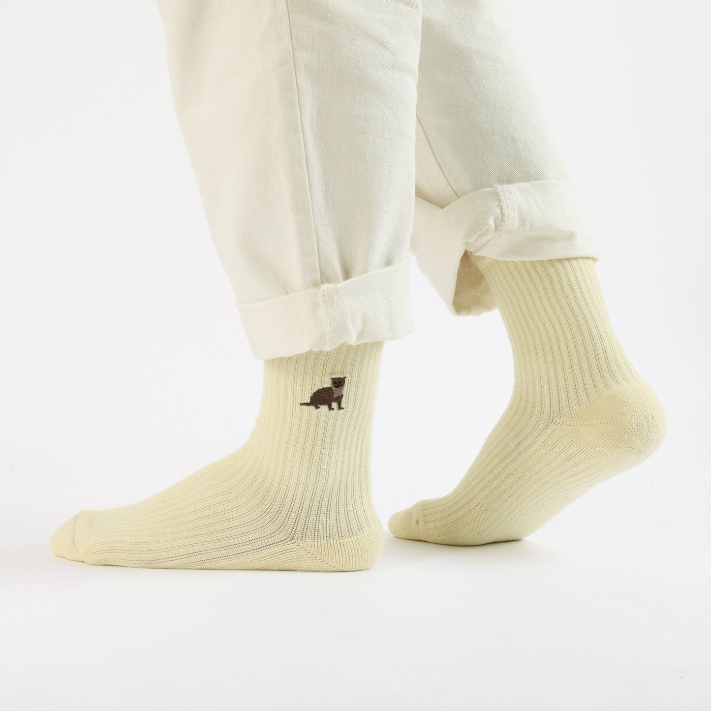 model wearing yellow otter ribbed bamboo socks