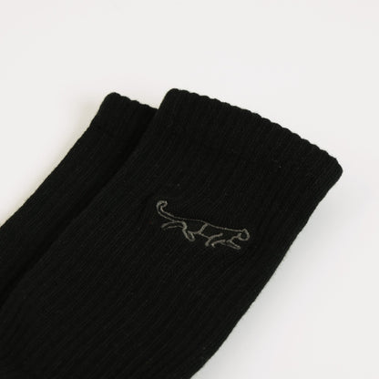 flat lays of black panther ribbed bamboo socks