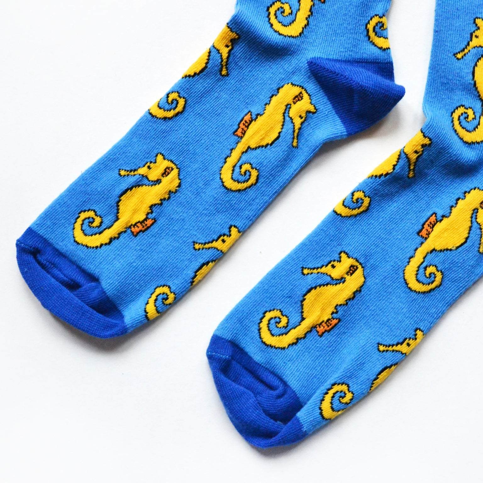Blue bamboo socks with animated seahorses supporting Save the Seahorses campaign