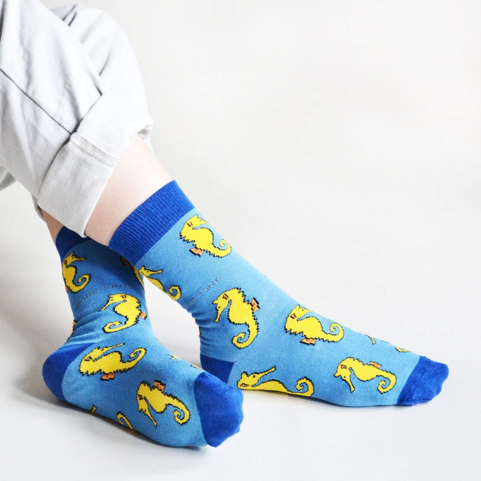 Blue Save the Seahorses bamboo socks with animated seahorse design, eco-friendly and comfortable.