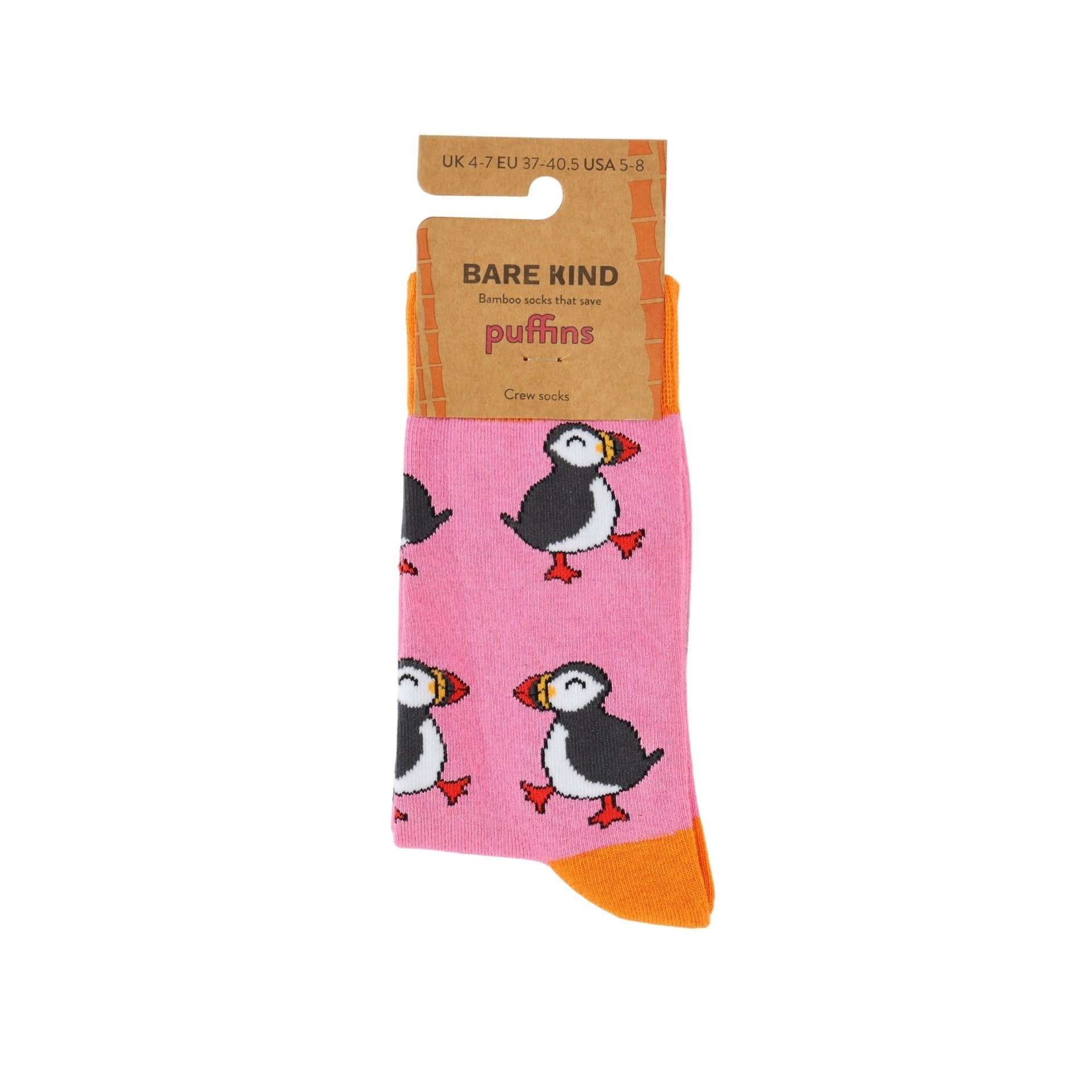 Pink socks with puffin design and 'Bare Kind' packaging on a white background