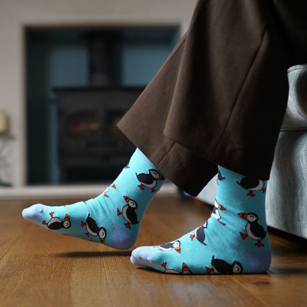 model wearing blue puffin socks