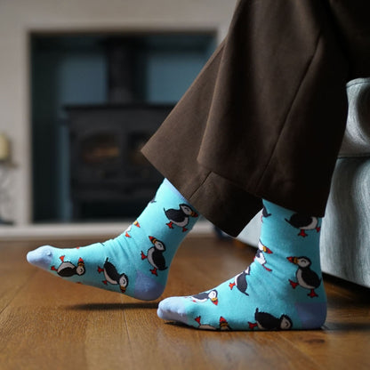 model wearing blue puffin socks