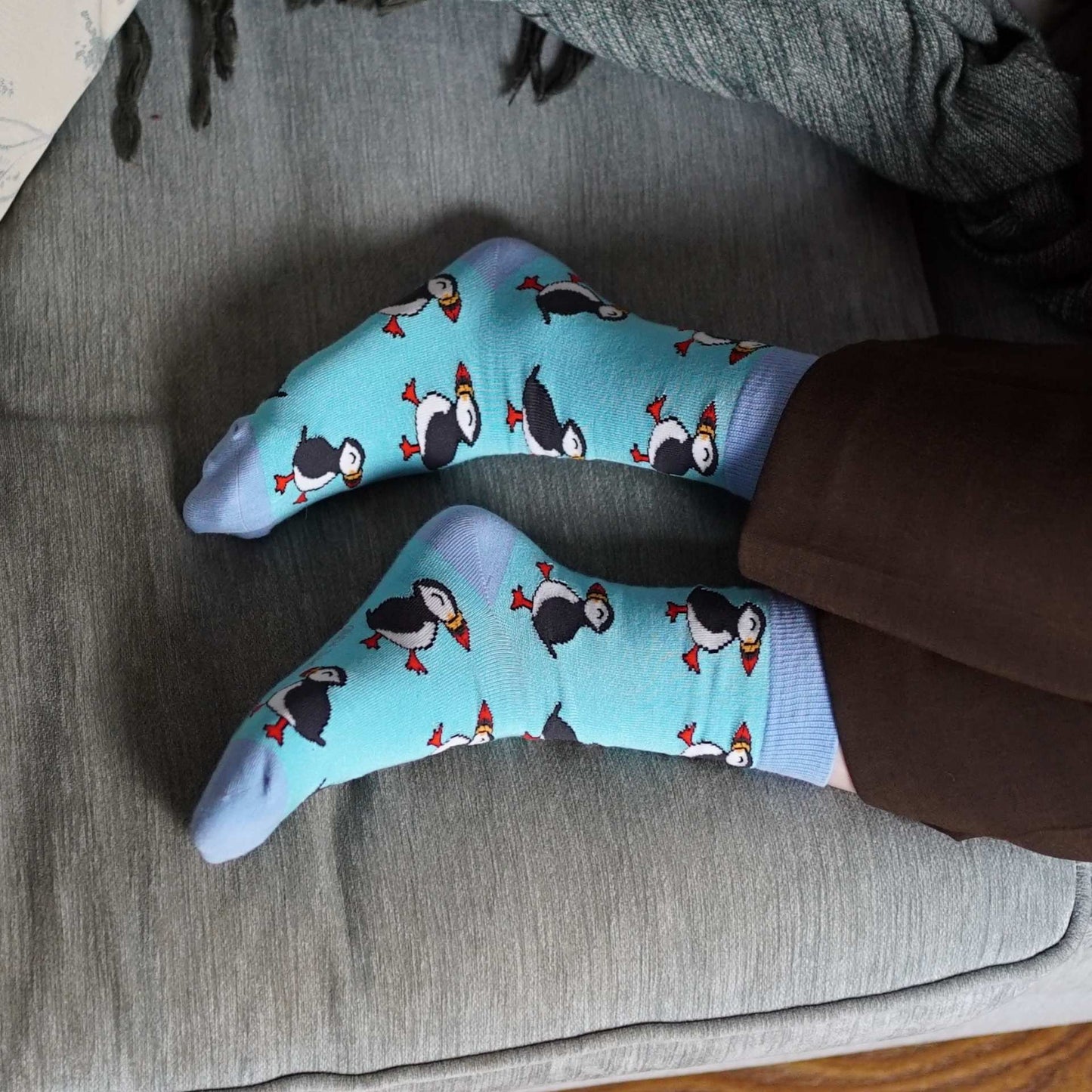 model wearing blue puffin socks