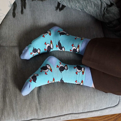 model wearing blue puffin socks