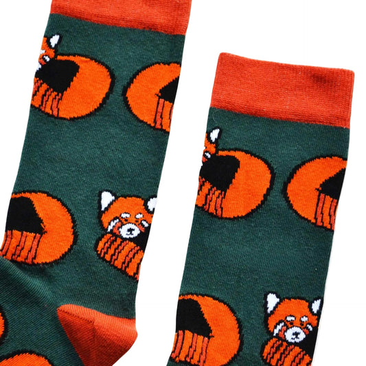 flat lay of dark green bamboo socks with woven red panda design