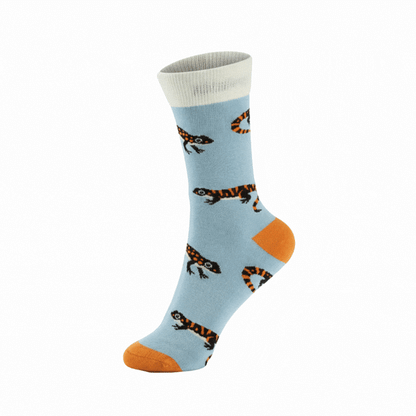 Pair of socks with salamander pattern on a light blue background
