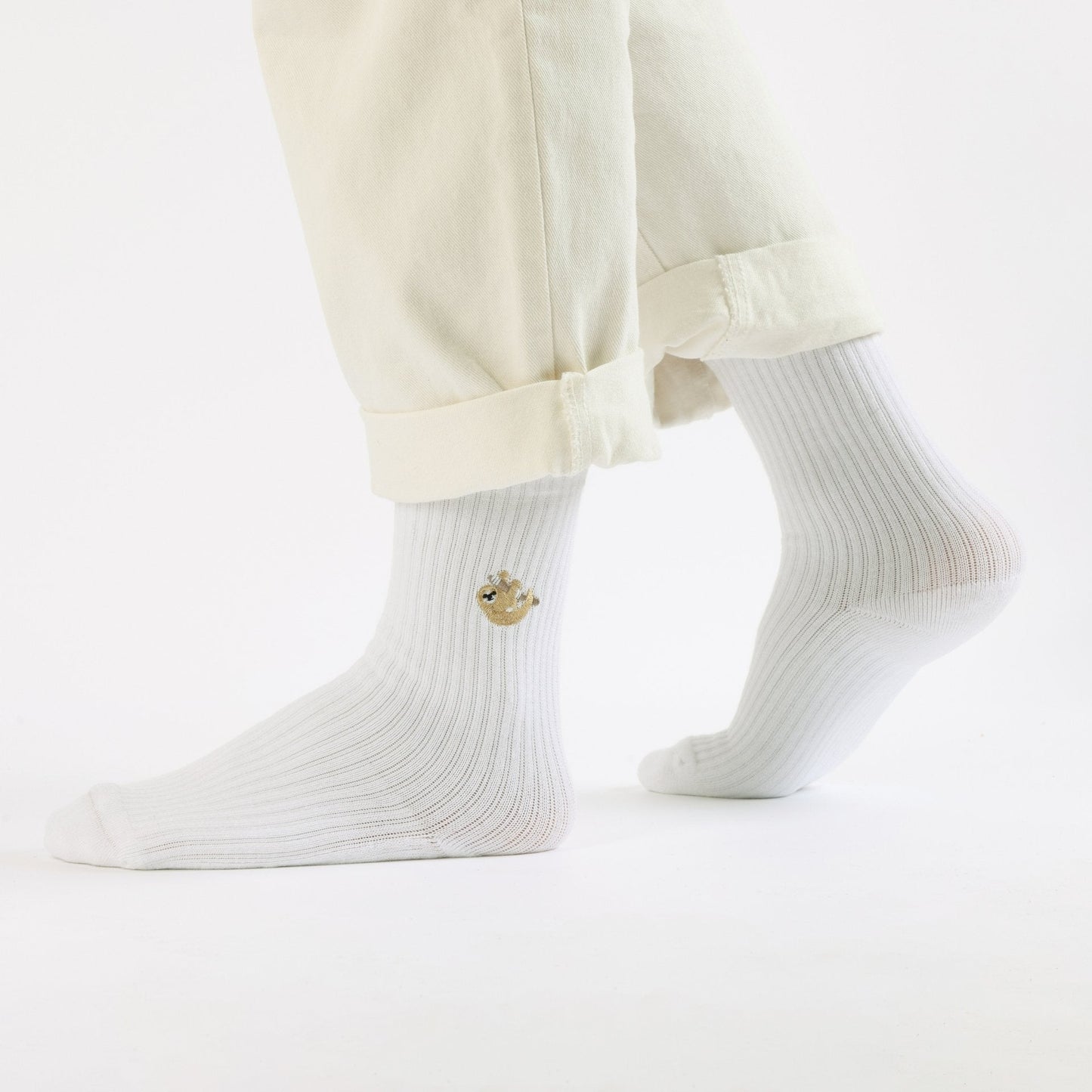 Model wearing white sloth ribbed bamboo socks