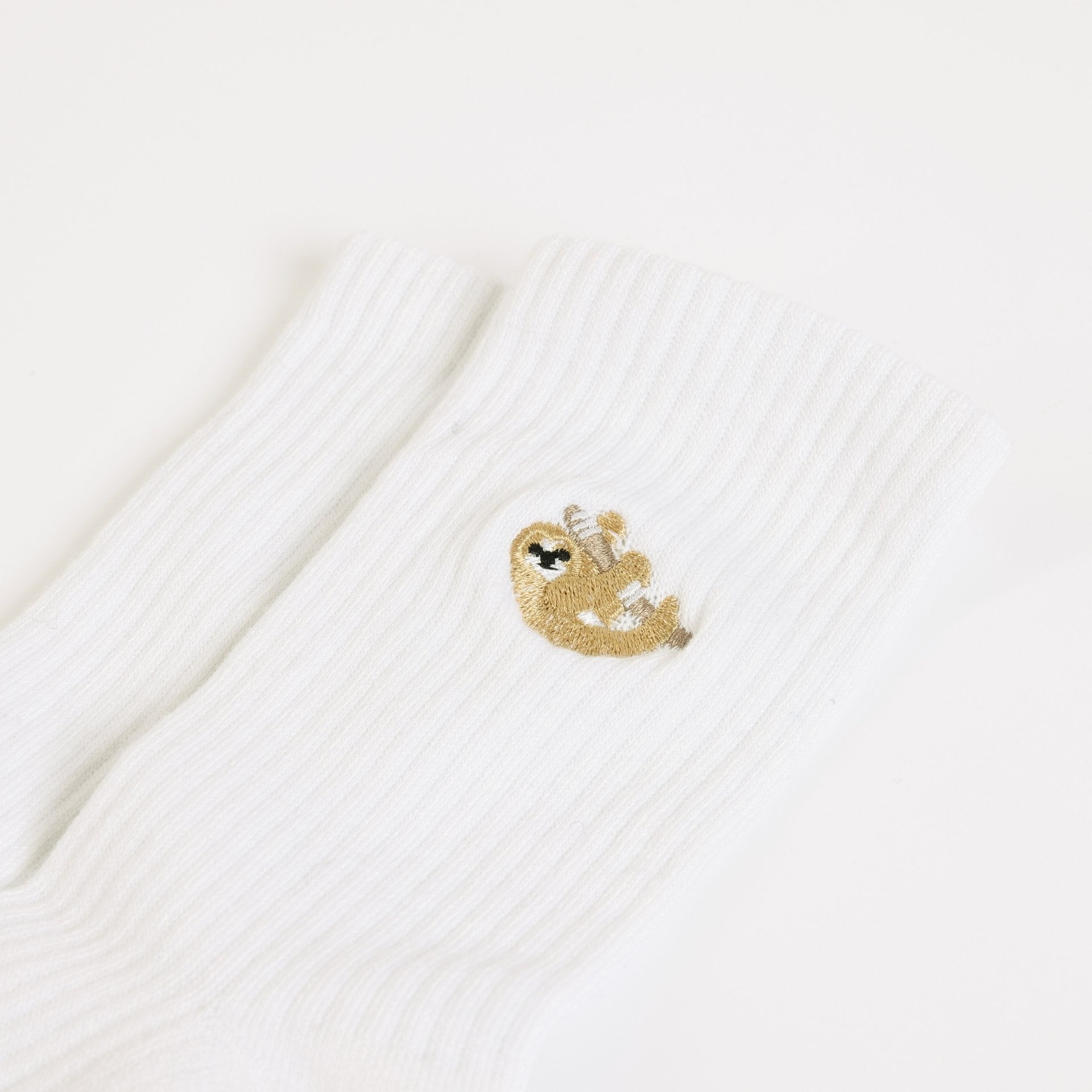 flat lays of white sloth ribbed bamboo socks