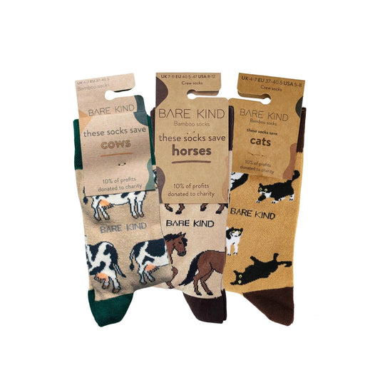 Three pairs of Bare Kind socks with animal illustrations and packaging on a white background
