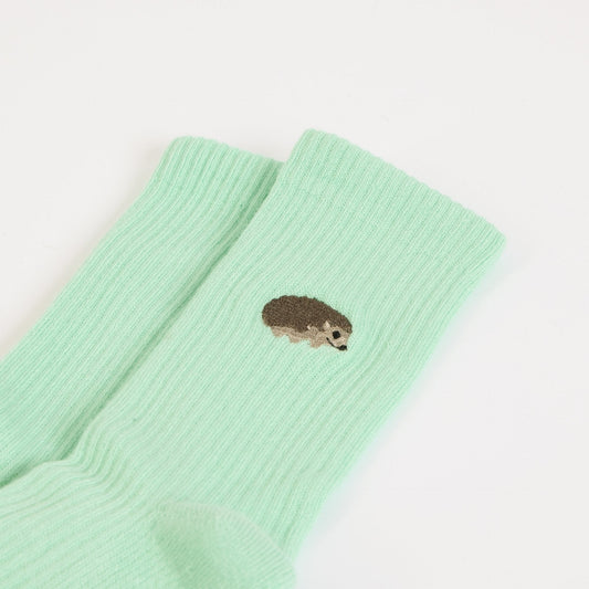 flat lays of green hedgehogs ribbed bamboo socks
