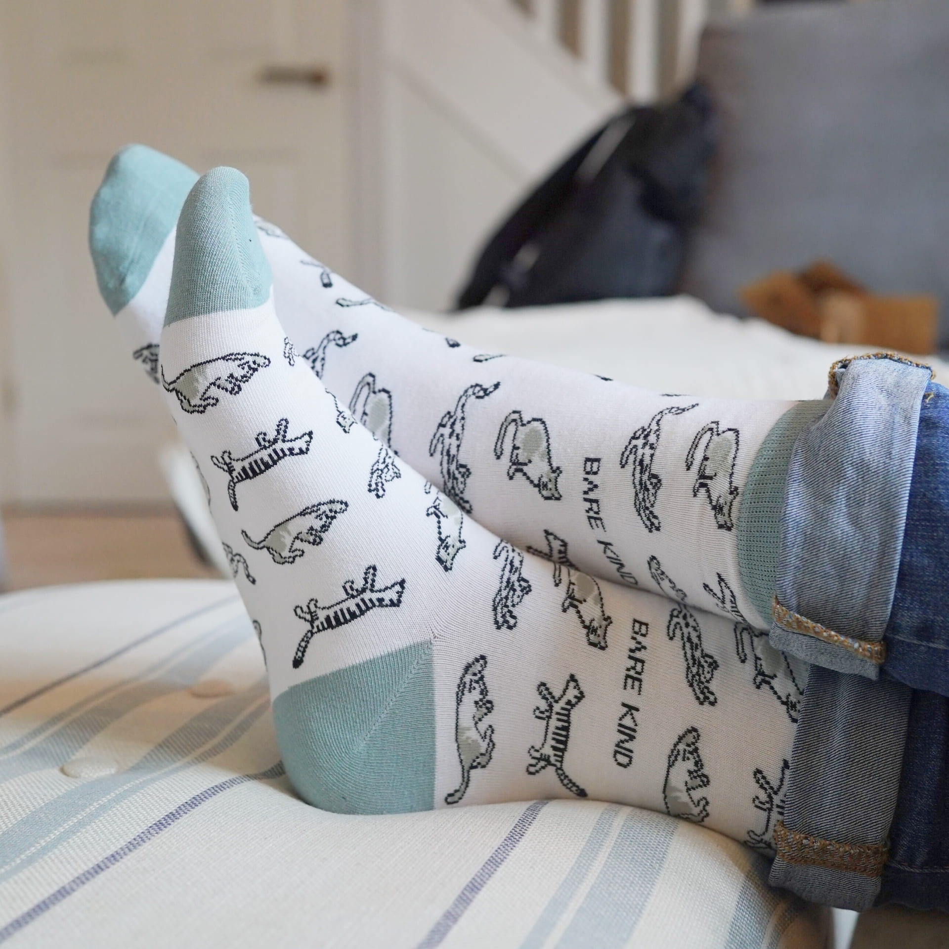 model wearing green cat bamboo socks