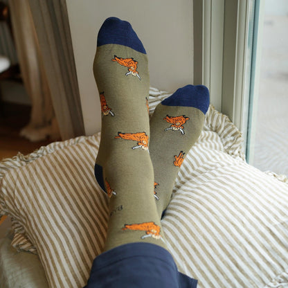 model wearing green highland cows bamboo socks